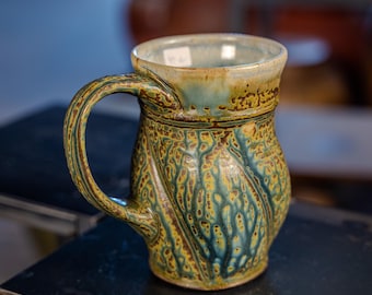 large beautiful 18 oz handmade stoneware mug, ash glaze with alterations.