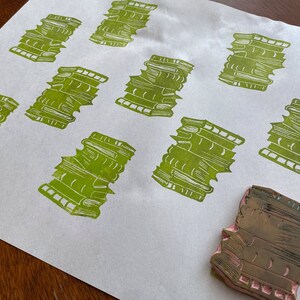 Stamps on newsprint make for eco friendly gift wrap.