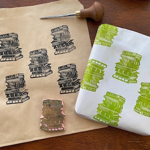 Hand carved rubber stamp of a stack of books