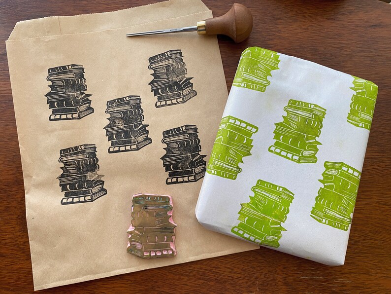 Hand carved rubber stamp of a stack of books