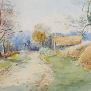 May include: A watercolor painting depicting a rural landscape with a dirt road leading to a small building with a red roof. The scene is set in a wooded area with trees on either side of the road. The painting is done in soft, muted colors, with a focus on the light and shadow.
