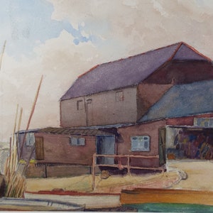 May include: Watercolor painting of a brown building with a gray roof and a blue sky. The building has several windows and a door. There are several boats in front of the building, some of which are partially submerged in the water.