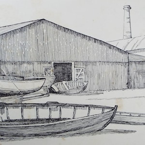 May include: Pen and ink drawing of a boatyard scene. Several small boats are on the shore and in front of a large wooden building. A tall smokestack rises in the background. The artwork is in black and white.