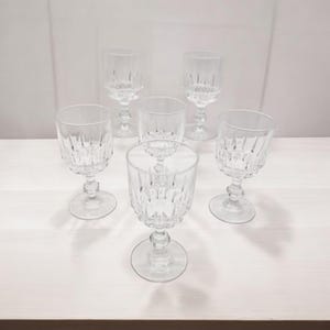 6 Luminarc crystal wine glasses.