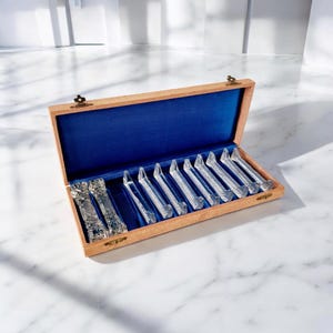 Antique crystal knife rest in box 11 pc