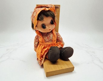 Vintage Kawaii Doll on Wooden Bench – Big Eyes, Orange Floral Dress
