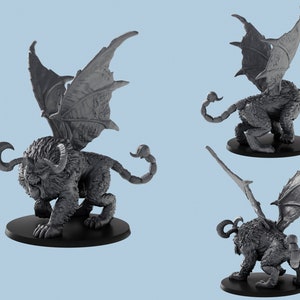 May include: A gray, detailed miniature of a winged lion with a scorpion tail. The miniature is posed in a standing position with its wings spread out.