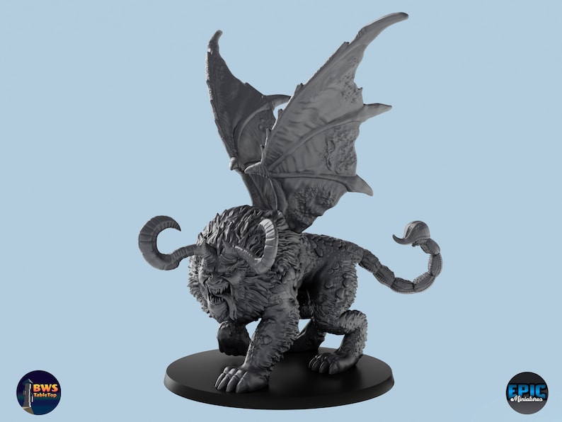 May include: A gray 3D printed miniature of a winged lion with a scorpion tail. The creature has a fierce expression and is posed in a standing position with its wings spread.