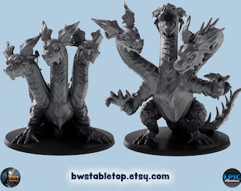 May include: Two gray, three-headed dragon miniatures on black bases. The dragons have detailed scales, wings, and multiple heads. The Etsy shop name, bwstabletop.etsy.com, is visible at the bottom of the image. The miniatures are designed for tabletop gaming.