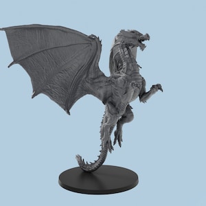May include: A gray dragon miniature with wings spread, standing on a black base. The dragon has a long tail and sharp claws.