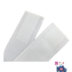 Puede incluir: Dos correas el&aacute;sticas blancas con cierres de velcro. Las correas est&aacute;n hechas de un material suave y transpirable y est&aacute;n dise&ntilde;adas para ser c&oacute;modas de llevar.