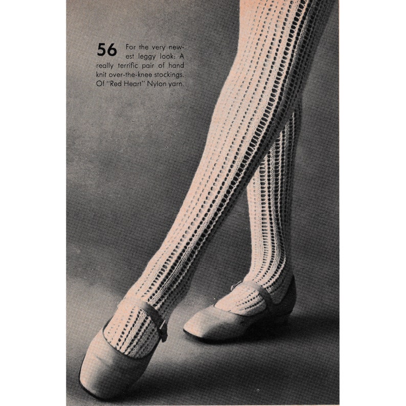 May include: A pair of white crocheted over-the-knee stockings. The stockings are knitted in a lacy pattern and are worn with white shoes. The text "For the very new-est leggy look: A really terrific pair of hand knit over-the-knee stockings. Of "Red Heart" Nylon yarn." is printed on the image.