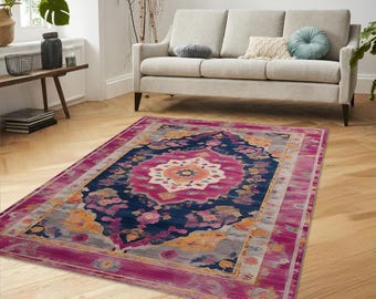 May include: A colorful rug with a pink, blue, and yellow floral pattern. The rug has a traditional Persian design and is perfect for adding a touch of bohemian style to any room.