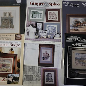 May include: A white ceramic mug with a black handle and the text "But First, Coffee" in a black, handwritten-style font. The mug is on a white surface.