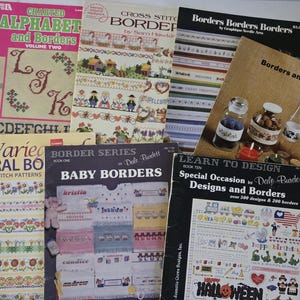 May include: A collection of seven softcover cross-stitch pattern books featuring various designs including alphabets, floral motifs, baby themes, and decorative borders. The covers display colorful needlework examples, instructional text, and titles such as Charted Alphabets and Borders, Baby Borders, and Special Occasion Designs and Borders.