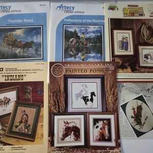 May include: Assortment of cross-stitch patterns featuring Western themes. The patterns include images of horses, Native Americans, and cowboys. The patterns are from Artecy, Bucilla, and C.R.O.S.S. MY. HEART. LN.C. The patterns are in various sizes and colors.