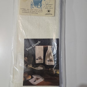 May include: A packaged terry cross stitch towel. The label reads "Terry Cross Stitch Towel" and "Empress" 16" x 26" 100% Cotton. The package also includes a "Free Graph" image of a cross-stitched towel set.