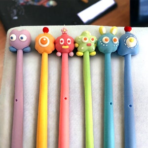 1 Stück Cartoon niedliches Monster Briefpapier Schwarze Tinte 0,5mm Gelstift Schule Bürobedarf Schönes Geschenk für Kinder Kawaii schreiben Liefern