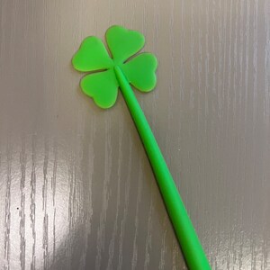May include: A green four-leaf clover shaped silicone stirring spoon.