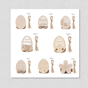 May include: Set of 8 wooden Easter egg ornaments with various designs, including a blank egg, a zig-zag pattern, a flower, and an egg with the text "Happy Easter". Each ornament comes with a jute twine hanger.