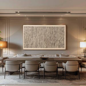 May include: A modern dining room featuring a long wooden table with six beige chairs. Above the table hangs a large framed abstract artwork with vertical lines. The room has neutral tones and a rug.