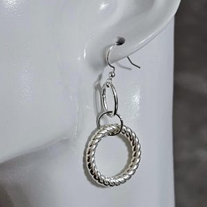 Silver Triple Loop Dangle Earrings: Twisted Ring Design