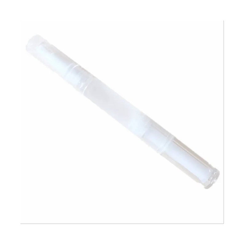 May include: A clear, pen-shaped nail cuticle oil applicator. The applicator is made of transparent plastic and has a white, absorbent tip. The pen is designed for easy application of cuticle oil to moisturise and condition nails.
