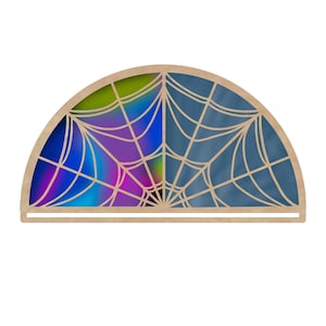 May include: A half-circle wooden wall decoration with a spiderweb design. The left side has a vibrant, multicoloured background, while the right side has a blue background. The top left corner has a teal and green circle with the text "Marmalade Digital".