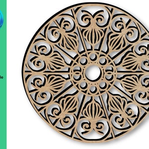 Op de afbeelding: Een zwart en bruin cirkelvormig ontwerp met ingewikkelde details, dat doet denken aan een mandala of een decoratief metaalwerkstuk. Het ontwerp heeft een centrale cirkel met stralende lijnen en bloemmotieven.