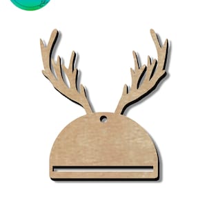 May include: Wooden reindeer ornament with antlers and a blank space for writing. The ornament is brown and has a hole for hanging.
