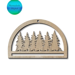 May include: Wooden cutout of a half circle with a forest scene inside. The cutout is brown and has a hole at the top for hanging. The forest scene is made up of six trees.