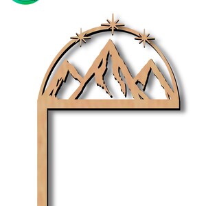 May include: A wooden cutout of a mountain range with stars above, designed for crafting projects. The cutout is in the shape of a half circle with a straight line extending down from the bottom.