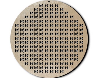 May include: A round, wooden decorative piece with a repeating pattern of bow-tie shaped cutouts. The piece is light brown with a small hole at the top for hanging. The design is symmetrical and geometric.