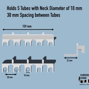 May include: A white plastic tube holder with five slots for tubes with a neck diameter of 10 mm. The holder is 15.9 cm long and has 3 cm spacing between each slot. The holder is designed to hold tubes with a neck diameter of 10 mm.