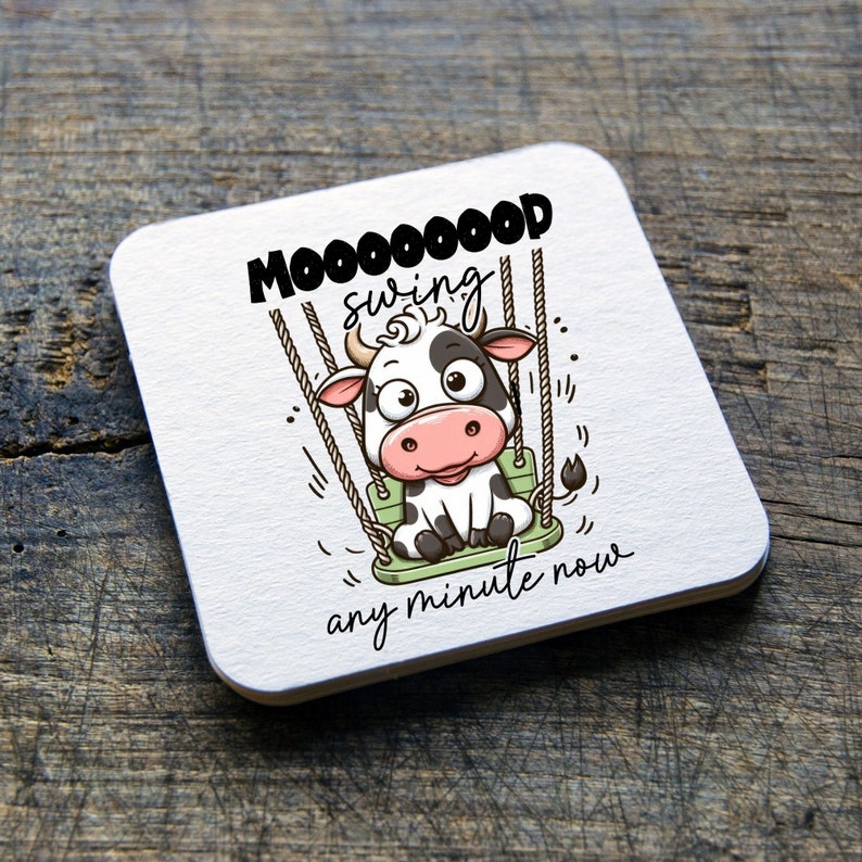 May include: A white and black cow cartoon character on a green swing with the text "Mooooood swing any minute now".