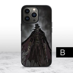 May include: Black phone case with a graphic of a man in a black coat and hat, holding a gun and a knife. The background is a dark, foggy scene.