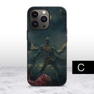 May include: A black iPhone case with a graphic of a green, skeletal creature with wings. The creature is standing on a dark, green background with a red, fleshy object in the foreground.