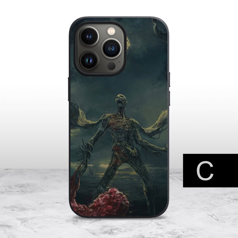 May include: A black iPhone case with a graphic of a green, skeletal creature with wings. The creature is standing on a dark, green background with a red, fleshy object in the foreground.