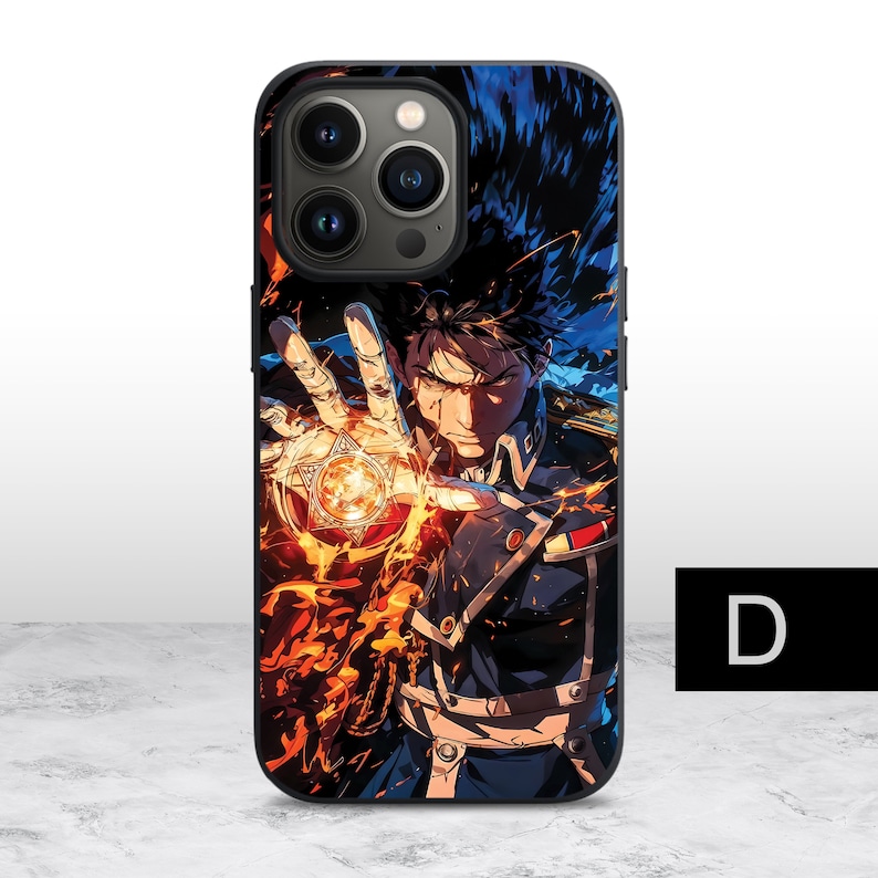 May include: A black phone case with a colorful anime illustration of a character with spiky black hair, holding a glowing orb in their hand. The character is wearing a dark blue and black uniform with gold accents. The case has a camera cutout with three lenses.