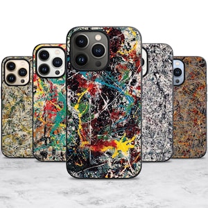 May include: A collection of five phone cases with abstract art designs. The cases feature a variety of colors, including red, yellow, blue, and green, with a black border. The designs resemble paint splatters.