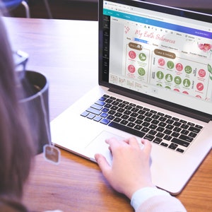 May include: A person using a laptop computer to plan their birth preferences. The screen shows a digital birth plan with icons and text. The text on the screen reads "My Birth Preferences".