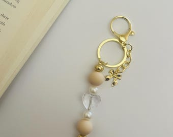 Bead Keychain, bow charm, Beige, pearl, gold, clear heart, key strap, beaded purse charm, Airpod Case charm, purse charm, phone charm