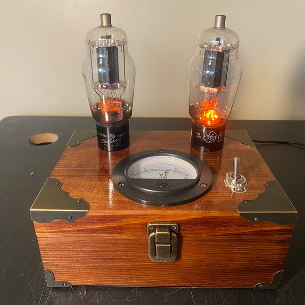 Steampunk inspired nightlight / accent light with GE vacuum tubes that have orange LEDs, walnut stain, voltmeter and corner protectors