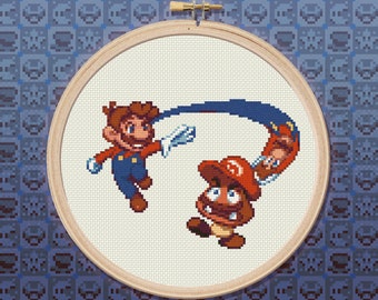 May include: Cross-stitch embroidery of Mario and a Goomba from the Super Mario Bros. video game series. Mario is wearing his signature red overalls and hat, while Goomba is in his signature brown and red colors. Mario is throwing a fireball at Goomba.