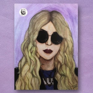 May include: Watercolor painting of a woman with long blonde hair wearing black sunglasses and a black leather jacket. She is looking directly at the viewer. The background is a light purple.
