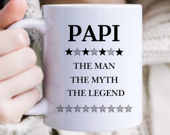 May include: White ceramic mug with black text that reads "PAPI" with five stars above the text and "THE MAN", "THE MYTH", and "THE LEGEND" below the text. There are nine stars below the text.