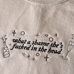 champagne problems embroidered sweatshirt