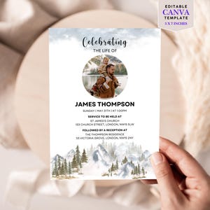 May include: A memorial announcement template with the text "Celebrating the Life of James Thompson." The design includes a photo of a man with a child, mountain and tree illustrations, and event details. The template is 5 x 7 inches.