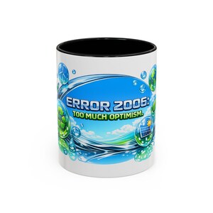 May include: White ceramic mug with a black interior, displaying the text "ERROR 2006: TOO MUCH OPTIMISM." The design incorporates a blue sky, water droplets, and green and blue graphic elements.