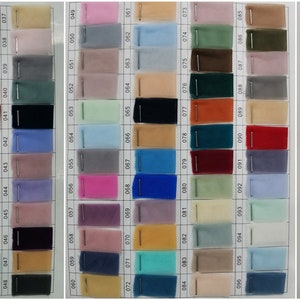 May include: A chart of 120 different colors of tulle fabric swatches. The swatches are arranged in rows and columns, and each swatch is labeled with a number.